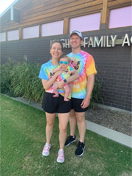 Doctor Megan Hanson with her husband and baby all in matching tie dye shirts