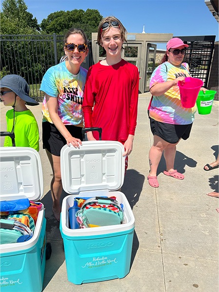 Orthodontic team with several coolers full of supplies