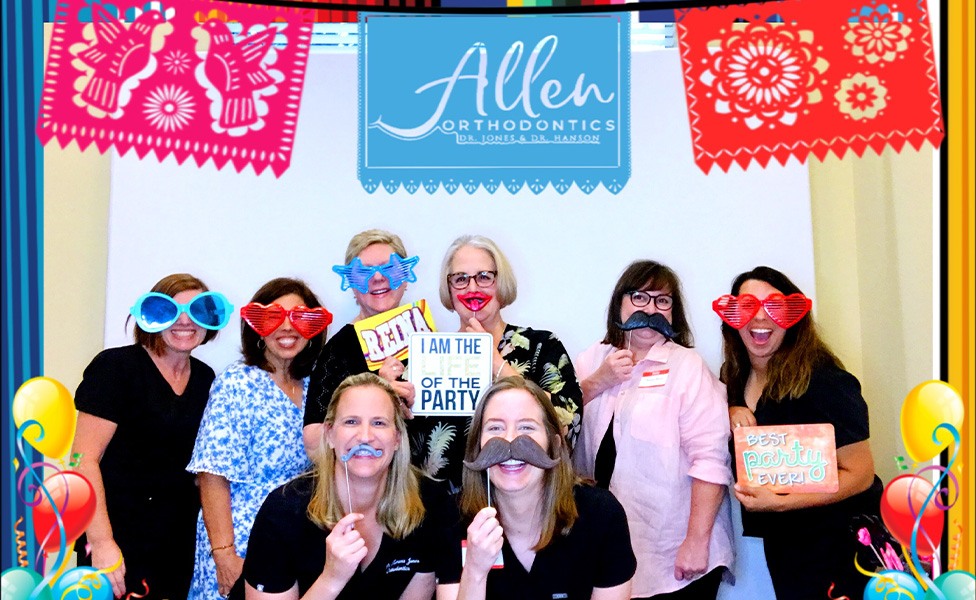 Multiple team members in a photo booth