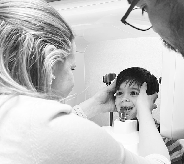 Young orthodontic patient getting digital dental x rays taken