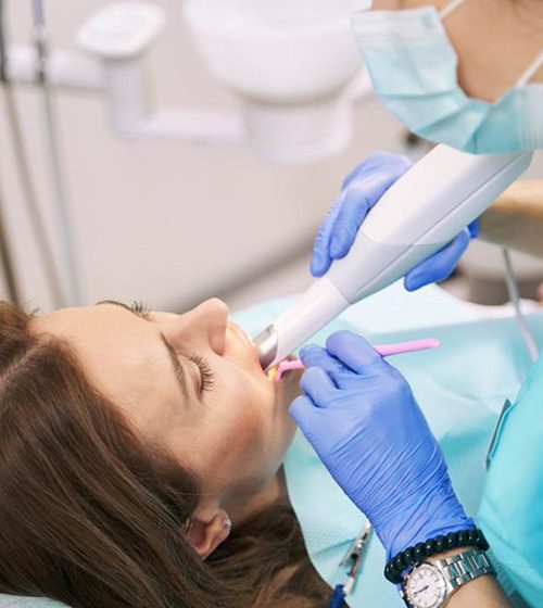 Dental patient undergoing digital impression scan of their teeth