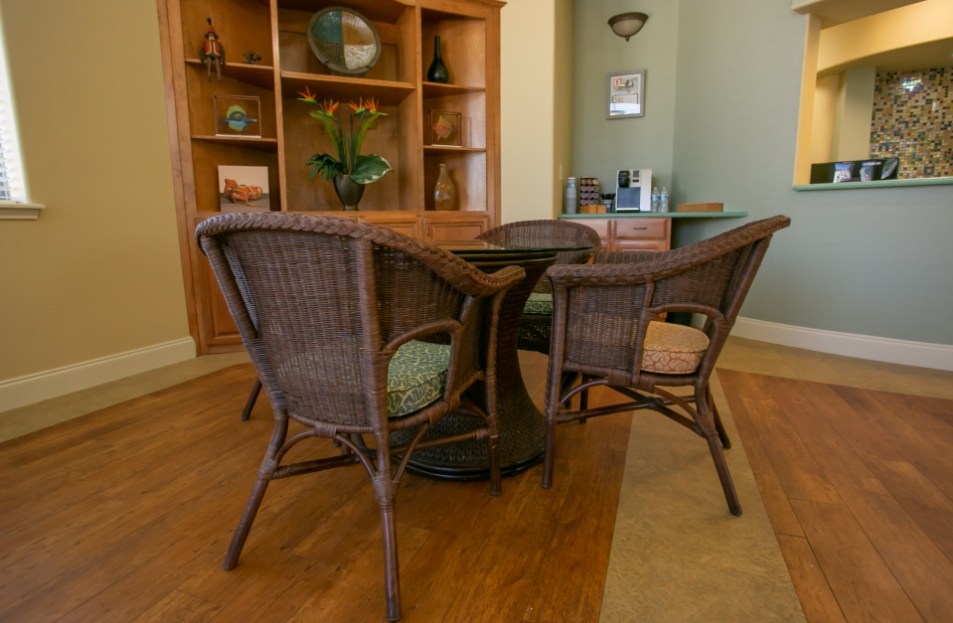 Three wicker chairs around a table