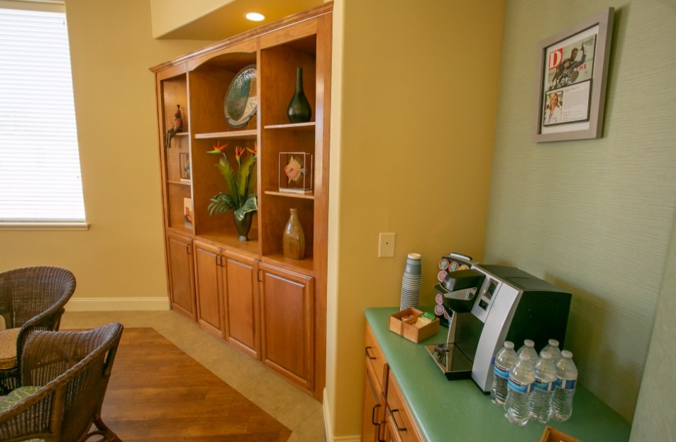 Countertop with a coffee machine and water bottles