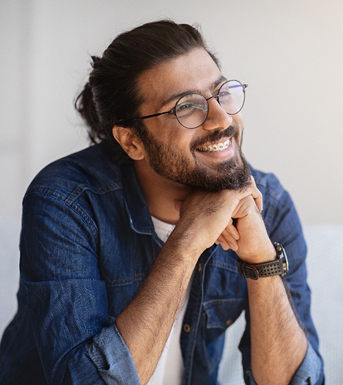 man smiling with braces