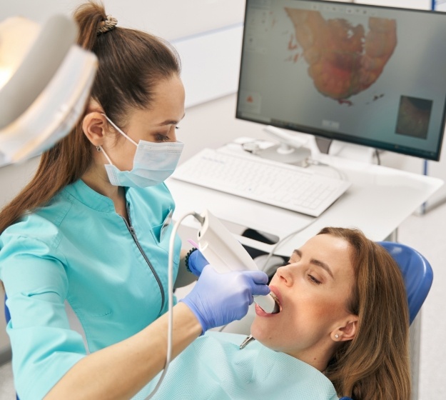 Orthodontist taking iTero digital impressions of a patients teeth