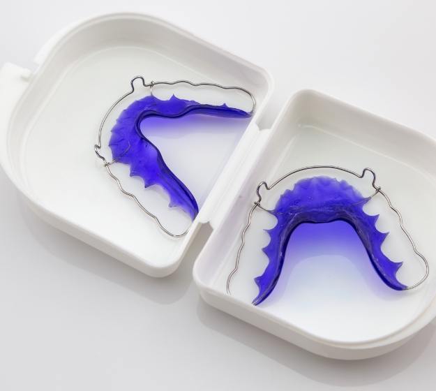 Set of retainers in a white plastic case