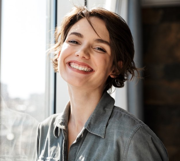 Smiling woman with short brown hair