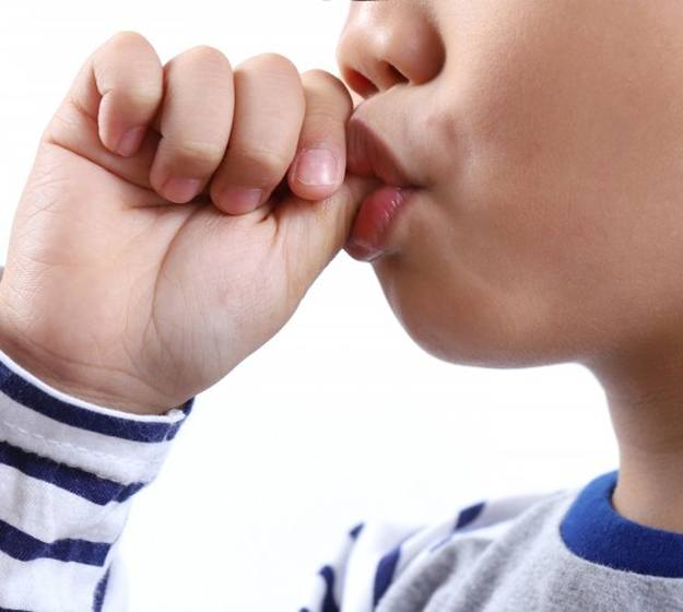 Close up of a child sucking on their thumb